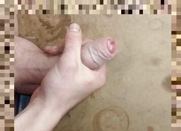 Jerking off a fat cock with cum