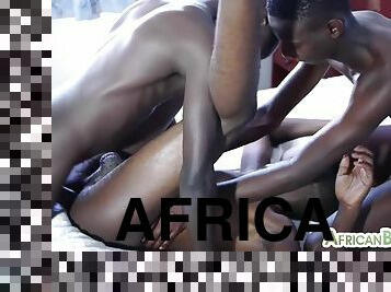 Oiled African twinks bang each other bareback in threesome