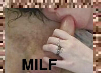 Milf takes facial on sofa