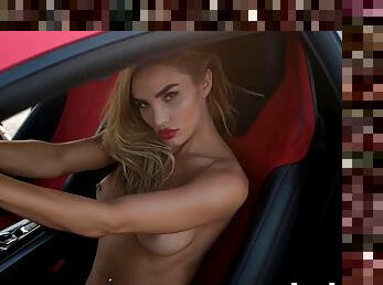 Stunning blonde with big boobs Miss Kenzie Anna poses naked in front of a stunning car