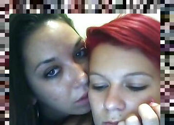 Brunette and redhead lesbians get kinky on webcam