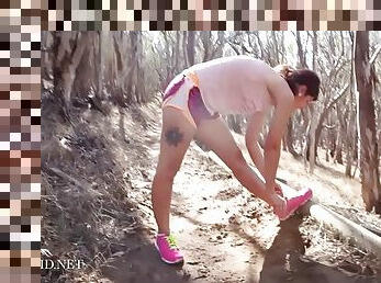 Brunette jogger has a naked run on her track