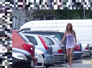 Chick lifts her dress to piss in a parking lot