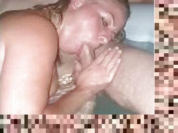 Hot shared wife sucks a willing friend in the hottub while Nick films.