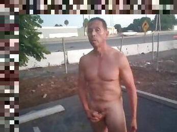 Naked guy public masturbation by the 55 FWY (with cumshot)